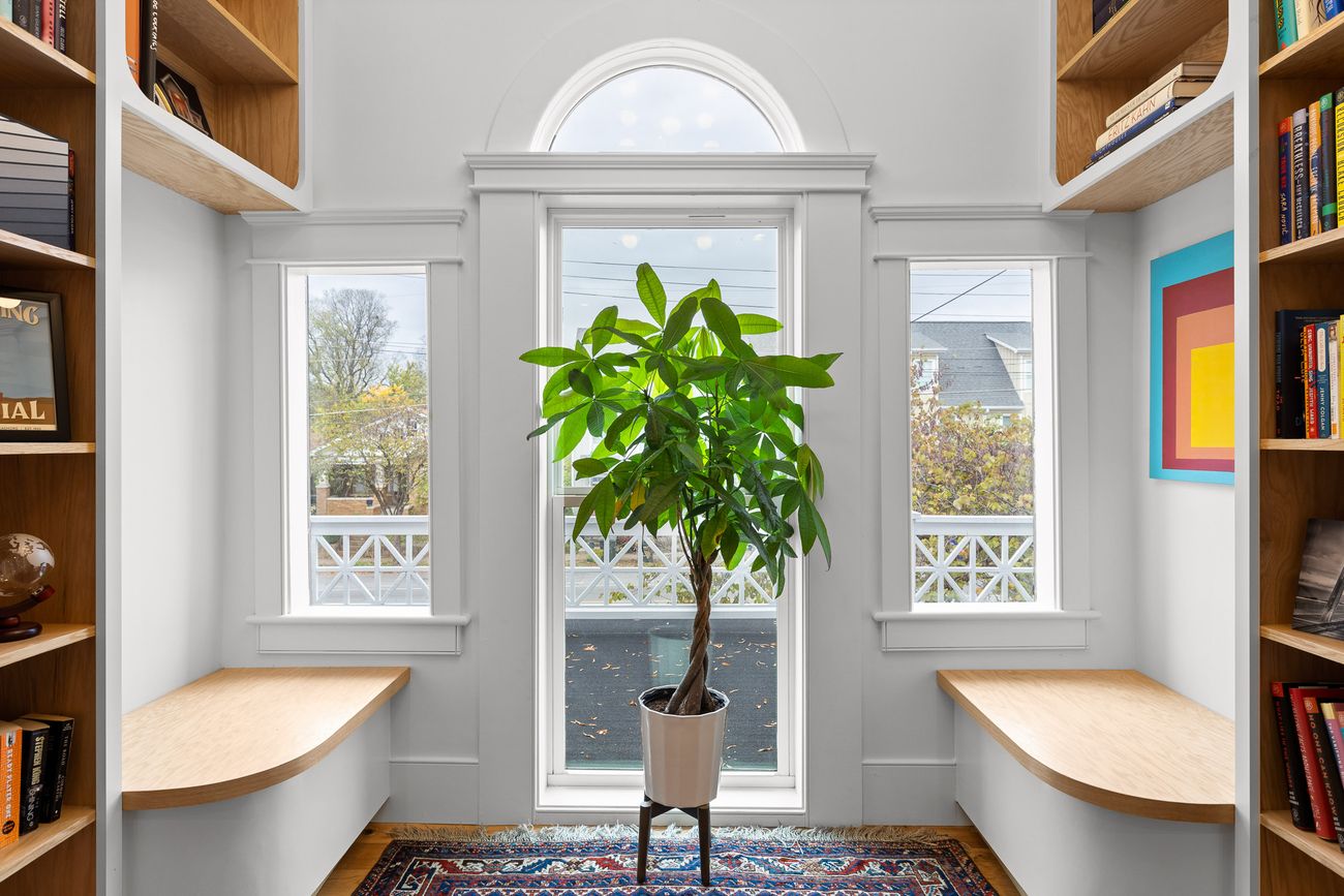 Floor-to-ceiling custom bookshelves with rolling ladder