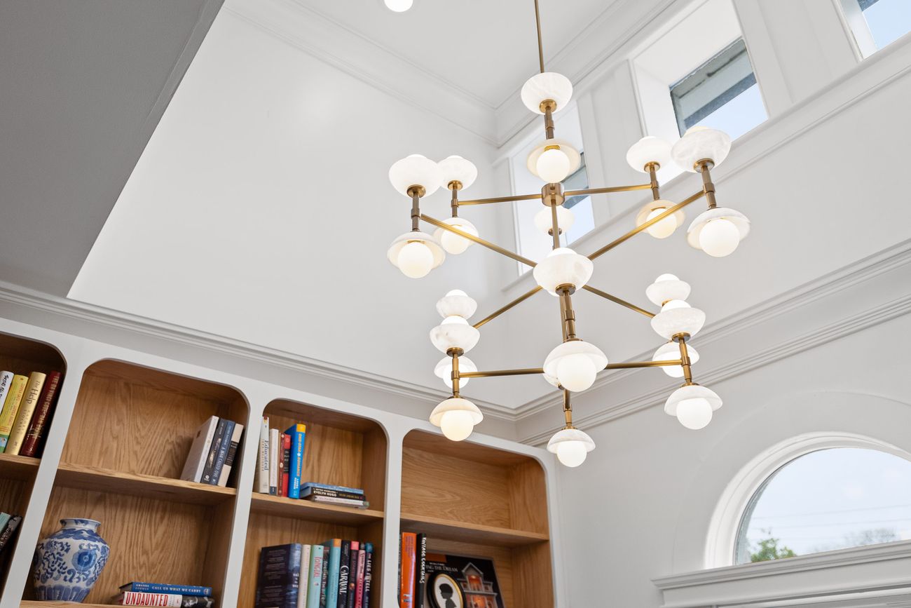 Floor-to-ceiling custom bookshelves with rolling ladder