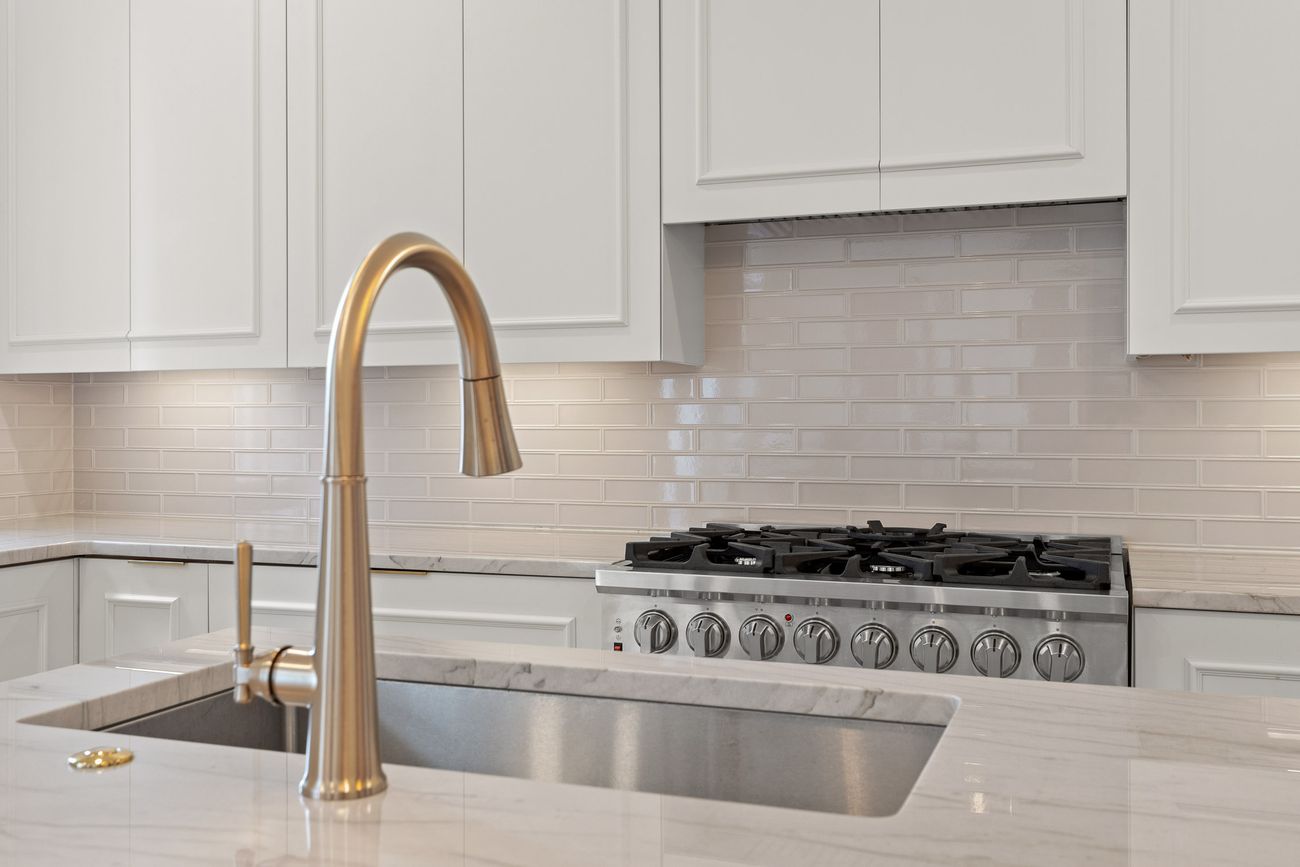 Handcrafted cabinetry and marble surfaces