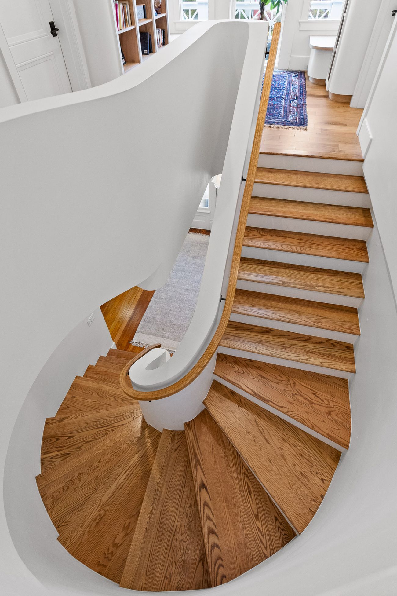 Hand-shaped oak handrail on the curved staircase
